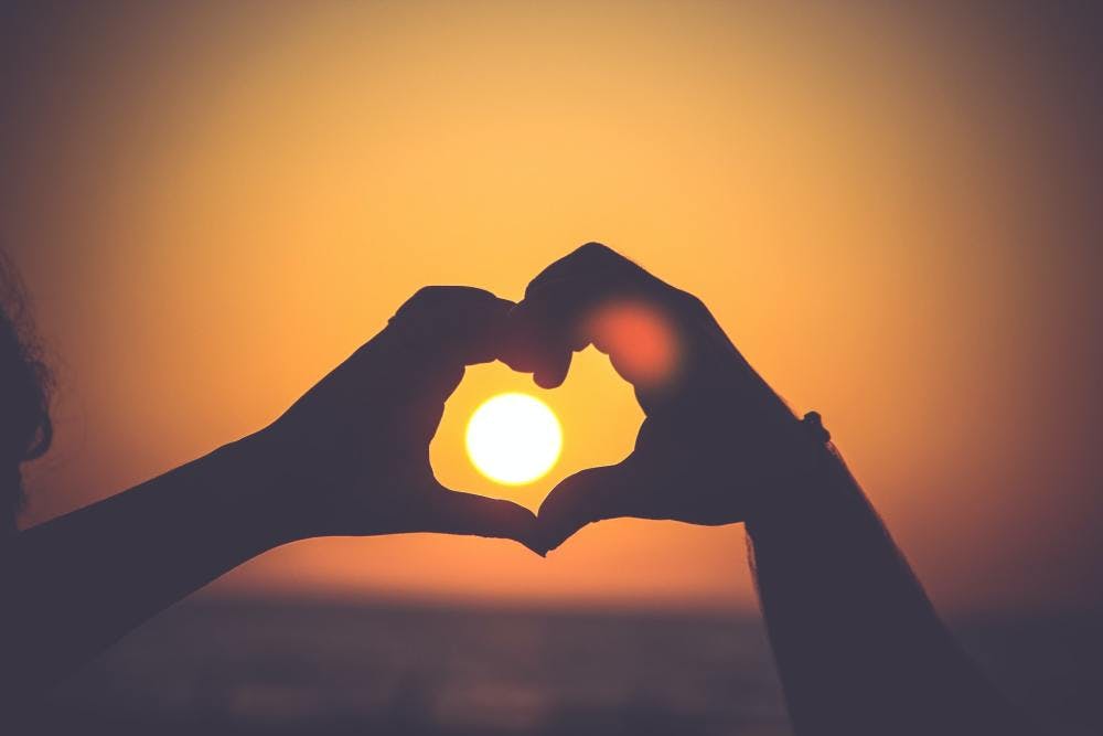 Heart in front of sun