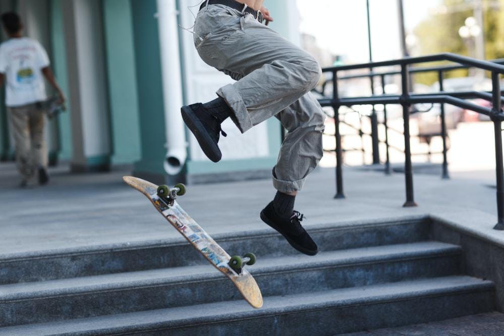 Skateboarder performing a jump on stairs